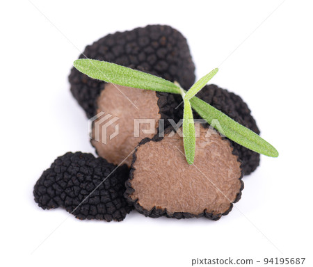 Black truffles isolated on a white background. Fresh sliced truffle. Delicacy exclusive truffle mushroom. Piquant and fragrant French delicacy. Clipping path. Black truffles isolated on a white background. Fresh sliced truffle. Delicacy exclusive truffle mushroom. Piquant and fragrant French delicacy. Clipping path. 94195687