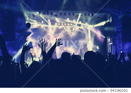 Crowd with arms outstretched at concert 94196201