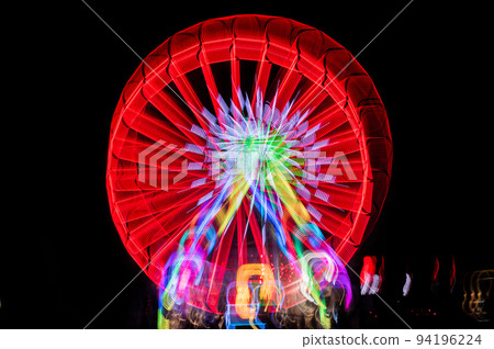 Blurred giant wheel, ferris at night Blurred giant wheel, ferris at night 94196224