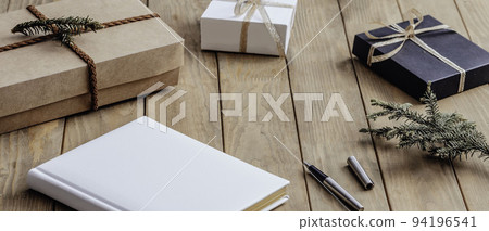 present boxes and diary. place on office table, concept to christmas gift and holiday season present boxes and diary. place on office table, concept to christmas gift and holiday season 94196541