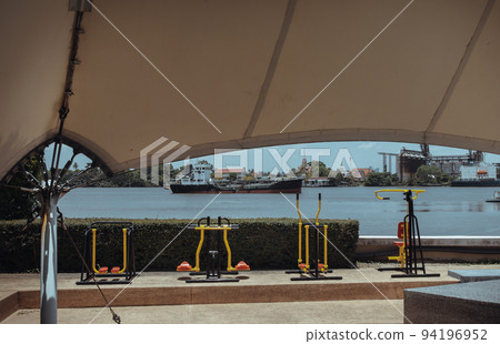 Various types of exercise equipment in the private park of condominium along the Chao phraya river. Various types of exercise equipment in the private park of condominium along the Chao phraya river. 94196952