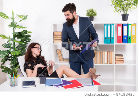 businessman give order manager. are you going to work. inconsistency with official duties. boss and employee. female against male. business couple in office. businesswoman feel lazy today 94198483