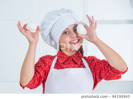 young baker child with eggs, easter young baker child with eggs, easter 94198943