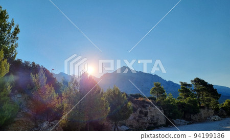 Sunrise over Biokovo Mountain Nature park and trees from Makarska Riviera-Biokovo 94199186