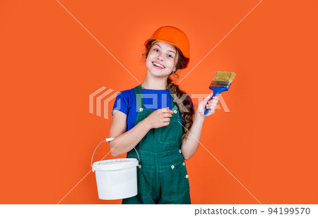 Confident worker. future engineer. happy kid use painting bucket and brush repairing tool. building construction site. child painter worker. labor day. childhood development. teenager girl assistant 94199570