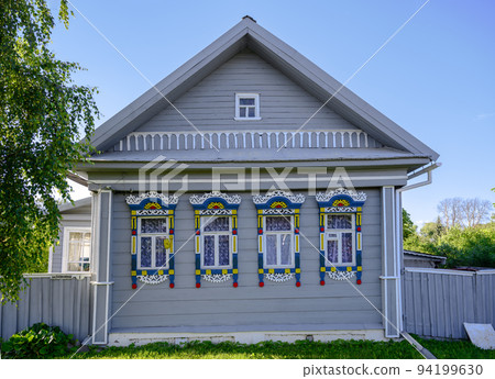 Carved multicolored platbands on a wooden house in Kazakovsky Lane in Pereslavl-Zalessky, Russia Carved multicolored platbands on a wooden house in Kazakovsky Lane in Pereslavl-Zalessky, Russia 94199630