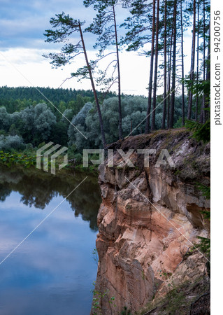 Scenic landscape of the Gauja river. Sandy stones on the shore. Summer nature in Latvia. Gaujas national park 94200756