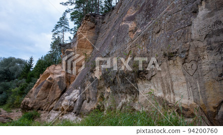 Scenic landscape of the Gauja river. Sandy stones on the shore. Summer nature in Latvia. Gaujas national park 94200760