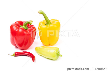 Variety of red and yellow colored bell and chili peppers isolated on white, copy space Variety of red and yellow colored bell and chili peppers isolated on white, copy space 94200848