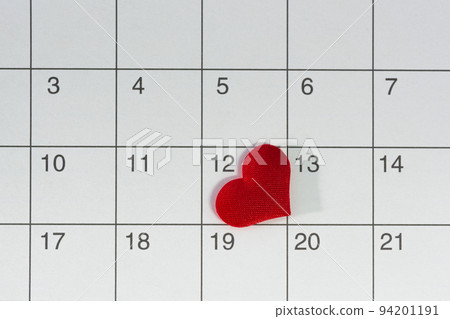 Red heart shape on the date of the 12th day in the calendar. Red heart shape on the date of the 12th day in the calendar. 94201191