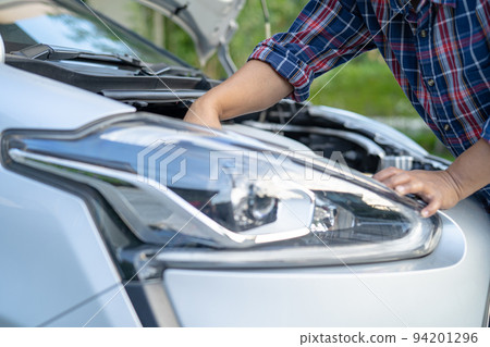 Open hood mechanic engine system to check and repair damage car crash. Open hood mechanic engine system to check and repair damage car crash. 94201296