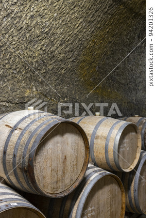 Wine cellars with barrels, traditional wine called Bikaver near Eger, Hungary 94201326
