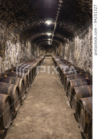 wine cellars with barrels, traditional wine called Bikaver near Eger, Hungary 94201327