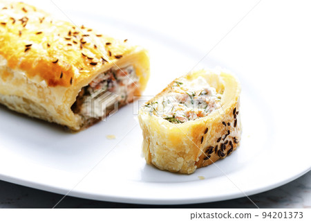 puff pastry filled with salmon, dill and cream cheese 94201373