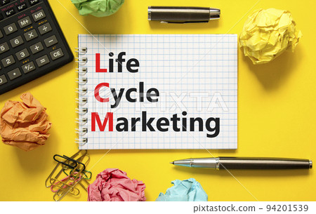 LCM lifecycle marketing symbol. Concept words LCM lifecycle marketing on white note on a beautiful yellow background. Black calculator and pen. Business LCM lifecycle marketing concept. Copy space. 94201539