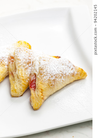 homemade puff pastry filled with strawberry jam homemade puff pastry filled with strawberry jam 94202145