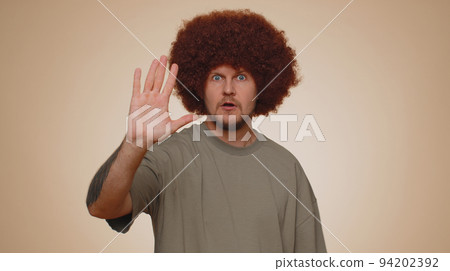 Man say no hold palm folded crossed hands in stop gesture, warning of finish, prohibited access Man say no hold palm folded crossed hands in stop gesture, warning of finish, prohibited access 94202392