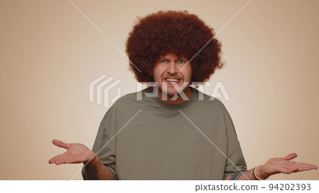 Man raising hands in indignant expression asking why what reason of failure demonstrating disbelief Man raising hands in indignant expression asking why what reason of failure demonstrating disbelief 94202393