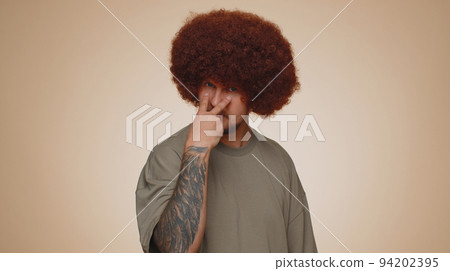 Serious man pointing at his eyes, show I am watching you gesture, spying on someone guilty disbelief Serious man pointing at his eyes, show I am watching you gesture, spying on someone guilty disbelief 94202395