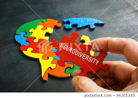 Neurodiversity concept. Brain from a puzzle and a hand holds a piece with an inscription. Neurodiversity concept. Brain from a puzzle and a hand holds a piece with an inscription. 94203330