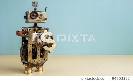 Old robot holds dollar sign as symbol of investment and savings. Old robot holds dollar sign as symbol of investment and savings. 94203332