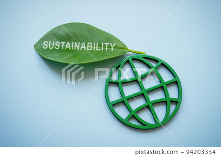 Globe and green leaf with word sustainability. Globe and green leaf with word sustainability. 94203334