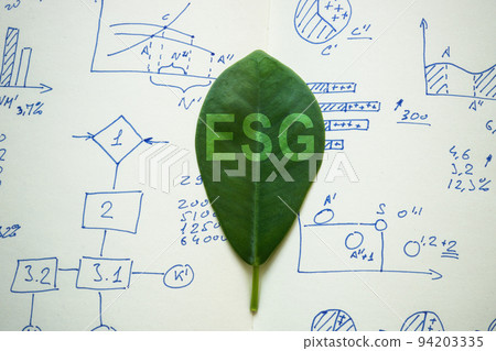 Leaf on charts with sign ESG Environmental, Social, and Corporate Governance. Leaf on charts with sign ESG Environmental, Social, and Corporate Governance. 94203335