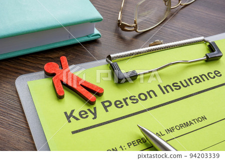 Key person insurance application and wooden figurine. 94203339