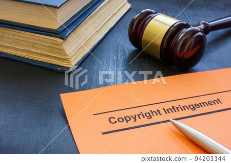 A Document about copyright infringement and gavel. A Document about copyright infringement and gavel. 94203344