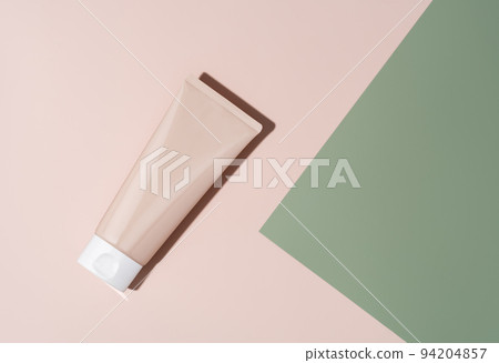 Cosmetic skin care product body lotion, shampoo, face cream or mask on pastel beige and green background in flat lay style. Natural beauty and organic cosmetics concept with copy space for your design Cosmetic skin care product body lotion, shampoo, face cream or mask on pastel beige and green background in flat lay style. Natural beauty and organic cosmetics concept with copy space for your design 94204857