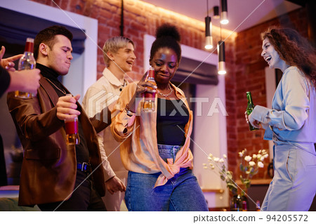 Happy young active lesbian and gay couples having beer and dancing Happy young active lesbian and gay couples having beer and dancing 94205572