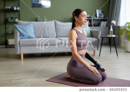 Young woman meditating during yoga Young woman meditating during yoga 94205933