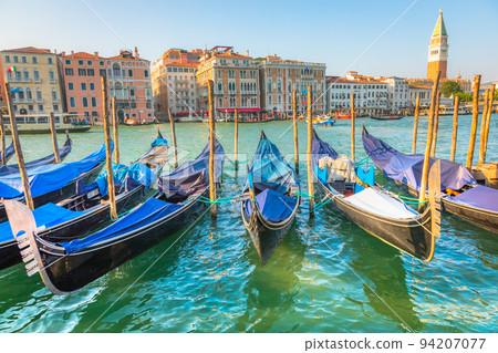 Gondolas in Grand Canal and campanile at golden sunset, Venice, Italy Gondolas in Grand Canal and campanile at golden sunset, Venice, Italy 94207077
