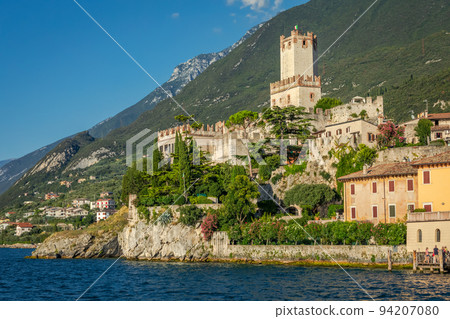 Idyllic Lake Garda in Malcesine old town at sunset, Italian alps Idyllic Lake Garda in Malcesine old town at sunset, Italian alps 94207080