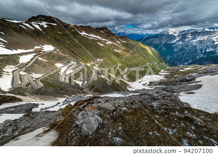 Stelvio mountain pass, impressive dramatic road in italian alps, Italy 94207100