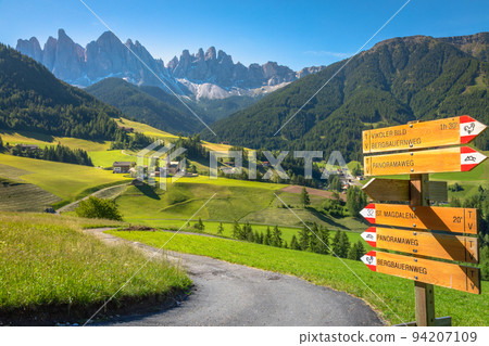 St. Magdalena village road sign with church in Val di Funes, Dolomites , Italy 94207109