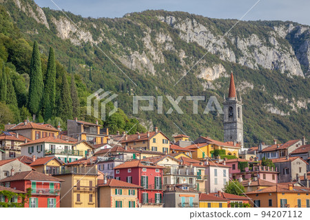 Idyllic Varenna village skyline from Lake Como at sunset, Northern Italy 94207112