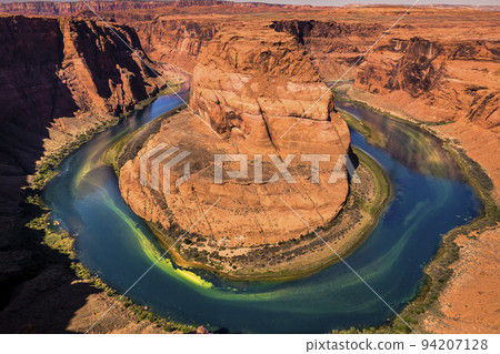 Horseshoe Bend above emerald Colorado River at sunset, Page, Arizona, USA 94207128