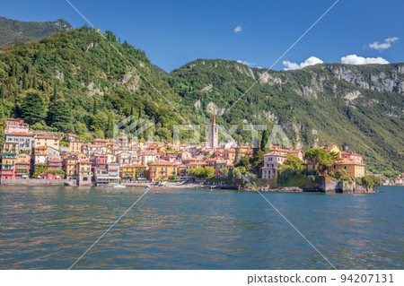 Idyllic Varenna village skyline from Lake Como at sunset, Northern Italy 94207131