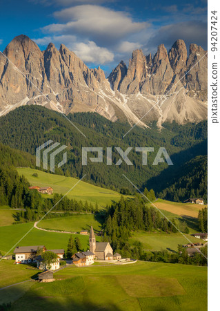 St. Magdalena with famous church in Val di Funes at sunset, Dolomites , Italy 94207424