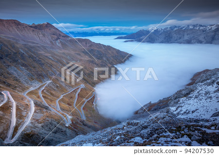 Stelvio mountain pass, impressive dramatic road in italian alps, Italy Stelvio mountain pass, impressive dramatic road in italian alps, Italy 94207530