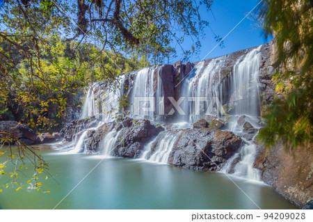 Southern Brazil countryside and waterfall landscape at peaceful sunset Southern Brazil countryside and waterfall landscape at peaceful sunset 94209028