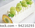Shine Muscat roll cake taken in bright natural light, horizontal position, closer to the white background 94210293