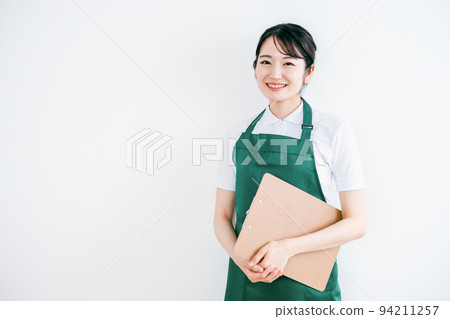 Women in aprons (housekeepers, caregivers, supermarkets) 94211257
