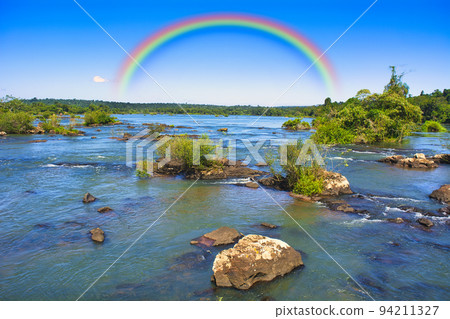 Rainbow over Iguazu Falls 94211327