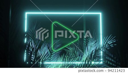 Image of play icon over neon shape and leaves on black background Image of play icon over neon shape and leaves on black background 94211423