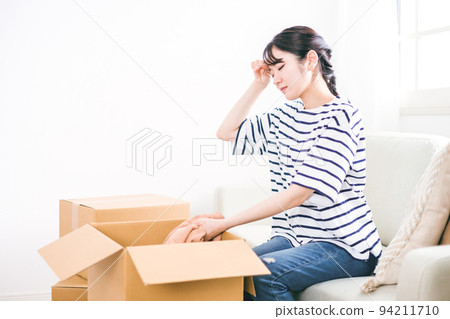 Japanese woman tired of moving work and packing Japanese woman tired of moving work and packing 94211710