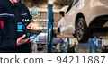 Asian man fix Technology AI fix car repair on car Lift in garage dealership Fix the car with a touch touching UI screen interface point to the point  corrected New technology in IOT car industry 94211887