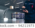 Asian Man Engineer hold smartphone touch touching UI screen interface for manufacturing industry technology Product export and import future Robot cyber warehouse arm robot future technology 94211973