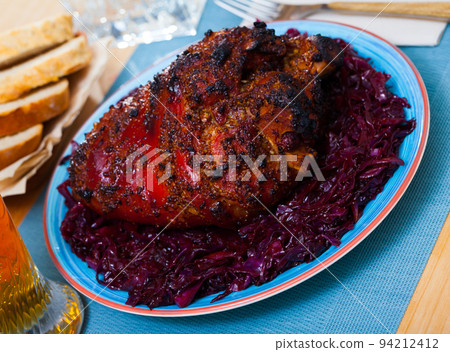 Roasted pork knuckle with braised cabbage 94212412